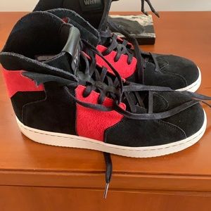 MJ’ classic sneakers, all black and red swayed.